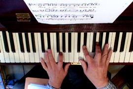 Fergus Black hands on piano from overhead camera